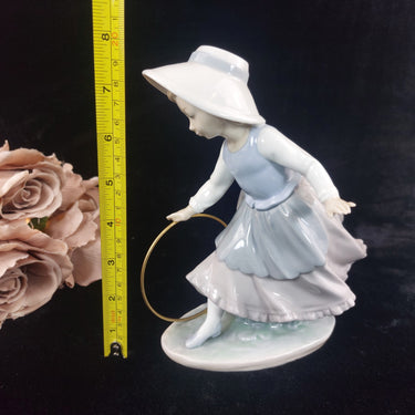 NAO Spain Girl Figurine with Hoop Glazed Porcelain  Worn Base A16M1