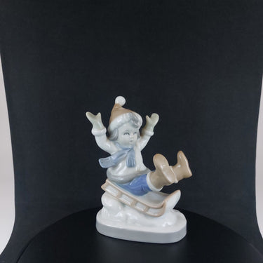 Vintage German Porcelain Child on Sled Figurine Winter Scene Ornament 12cm