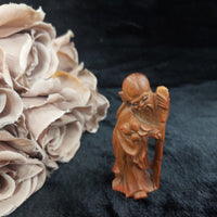 Thumbnail for Hand-Carved Teak Wood Asian Elder Figurine – Holding Staff & Fruit 3.75