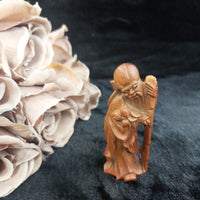 Thumbnail for Hand-Carved Teak Wood Asian Elder Figurine – Holding Staff & Fruit 3.75